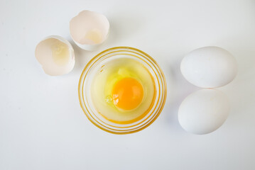raw eggs on a white background. Egg in a bowl.