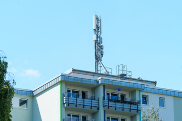 base station tower of a cellular network on the top of a residential building