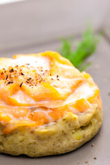 salty cake filled with cream cheese served with smoked salmon and dill