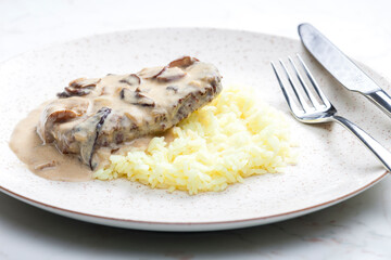meat with mushroom sauce and white rice