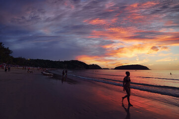 Fototapeta na wymiar Beautiful landscape. Tropical sunset on the sea shore.