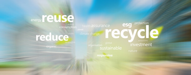 Ecological concept. Recycle keywords on motion blur of skyscrapers background.