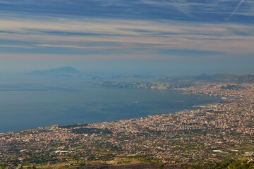 Panoramic view from volcano Mount Vesuvius on the bay of Naples, Province of Naples, Campania region, Italy, Europe. Looking at the island of Capri and Mediterranean coastline on a cloudy day.