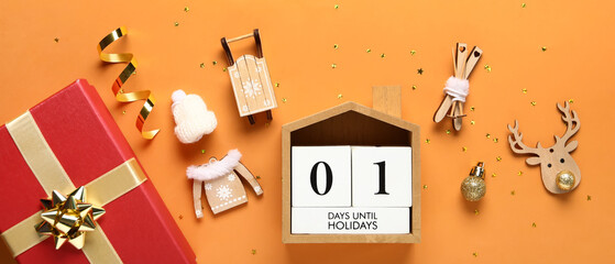 Christmas decorations, gift box and calendar  on orange background