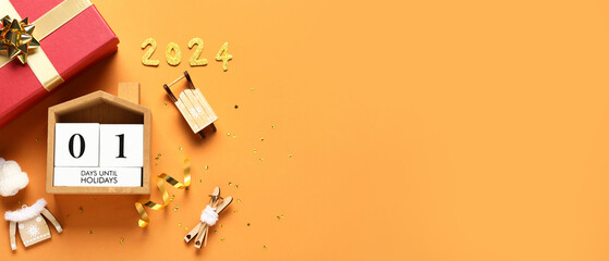 Christmas decorations, gift box and calendar  on orange background with space for text