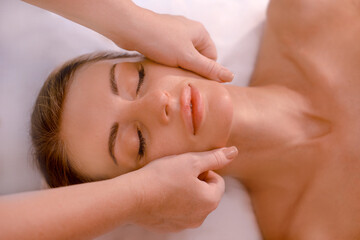 Fototapeta na wymiar Close-up of woman getting spa treatment at beauty salon. spa face massage