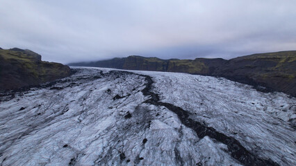 Aerial view of the Solheimajokull is an outlet glacier of the mighty icecap of Myrdalsjokull on the South Coast of Iceland. It is the fourth-largest ice cap in Iceland.