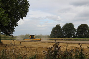 Farmland near Airmyn near Boothferry bridge in the East Riding of Yorkshire UK.A combine harvester...