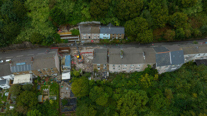 Editorial Swansea, UK - August 28, 2023: Demolition has begun on a row of houses in Cyfyng Road, Ystalyfera, Neath Port Talbot after being deemed unsafe after a landslide in 2017.
