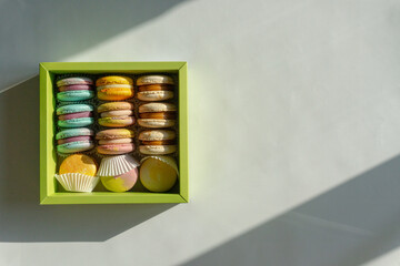 colorful macaroons in the box. Macarons. Copy space, top view