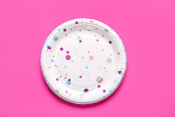 Paper disposable plate on pink background