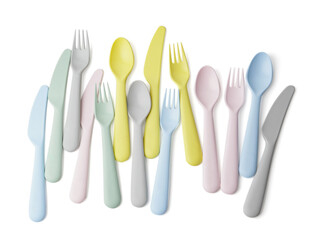 Plastic eating utensils for baby on white background
