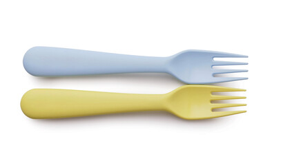 Plastic forks for baby on white background