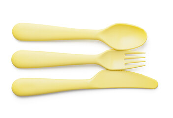 Plastic eating utensils for baby on white background