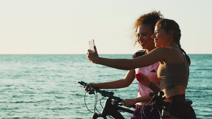 Friends bicyclists riding bikes in the morning and making selfie. Cycling sports healthy lifestyle