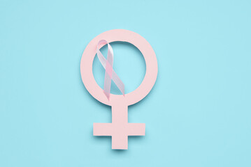 Female gender symbol with awareness pink ribbon on color background. Breast cancer concept