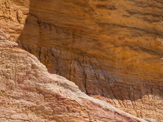Fototapeta na wymiar Abstract Rustrel canyon ocher cliffs landscape. Provencal Colorado near Roussillon, Southern France.