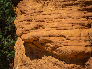 Abstract Rustrel canyon ocher cliffs landscape. Provencal Colorado near Roussillon, Southern France.