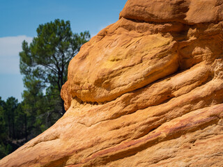 Abstract Rustrel canyon ocher cliffs landscape. Provencal Colorado near Roussillon, Southern France.