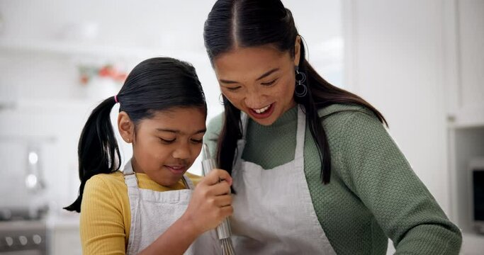 Mother, girl and happy cooking in kitchen for love, care and learning recipe for dessert, food and baking. Child, mom and smile for helping to whisk ingredients, teaching kid how to bake at home