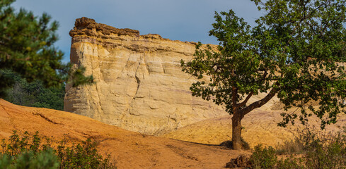 Abstract Rustrel canyon ocher cliffs landscape. Provencal Colorado near Roussillon, Southern France.