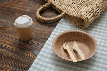 Beautiful table setting for picnic on wooden background