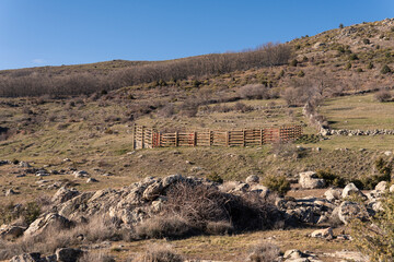 view of animal pens, mountains in Spain