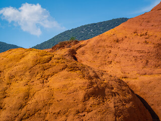 Abstract Rustrel canyon ocher cliffs landscape. Provencal Colorado near Roussillon, Southern France.