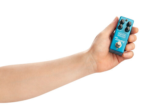 mxr timmy overdrive guitar pedal in hand path isolated on white