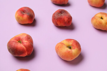 Sweet fig peaches on lilac background