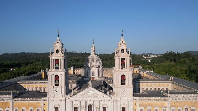 Aerial jib shot showing the 18th-Century Royal Convent and Palace of Mafra, a monumental Baroque and Neoclassical palace-monastery located in Mafra, Lisbon District, Portugal. 