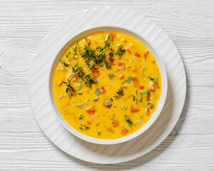 Beer cheese soup with vegetables and thyme