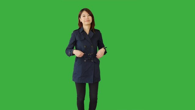 Young Asian Woman Standing Isolated on Green Screen Background