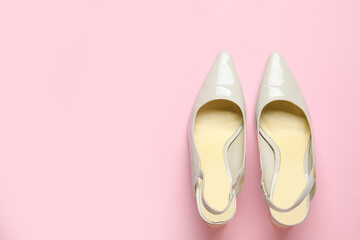 Stylish grey high heels on pink background