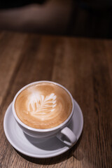 Latte art. Сoffee drinks on wooden table background, top view. Banner design