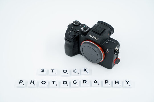 Stock Photography being spelled out using Scrabble letters with Sony camera isolated. Ankara, Turkey - August 25, 2023.