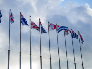 Flags against the sky. Flags of Georgia and Adjara. Flagpoles.