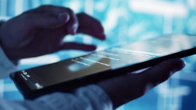 Close up shot of programming scripts on tablet, employing AI machine learning infrastructure. Trained professional manipulating lines of code for artificial intelligence applications development