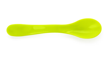 Green plastic spoon for baby on white background