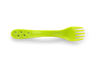 Green plastic fork for baby isolated on white background