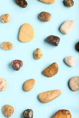 Many pebble stones on blue background