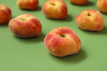 Sweet fig peaches on green background