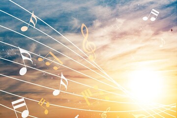 Beautiful musical notes on sunset sky background
