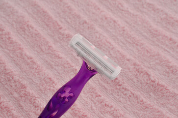An elegant image of a female shaver on a smooth surface, conveying the feeling of smoothness and comfort when shaving.