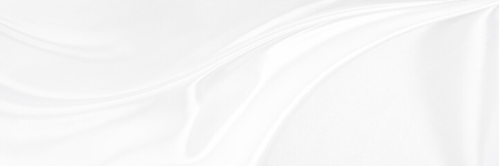 White gray satin texture that is white silver fabric silk panorama background with beautiful soft...