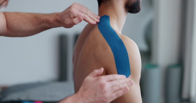 Physiotherapy, shoulder strap and man patient with sport massage therapist and arm injury at clinic. Healthcare, support and chiropractor with exercise and fitness rehabilitation in a consultation