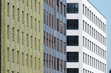 newly built office buildings in green, grey-brown and white in a commercial area in cologne mülheim 2023