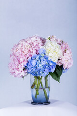 Many kinds of beautiful flowers put in vase on a white background © the_akg