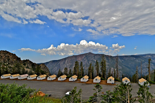 Summer Glammping Cabins at Bear Valley Ski Resort, California. Mokelumne Peak with clouds in background 