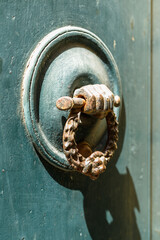 Old knocker on the entrance door